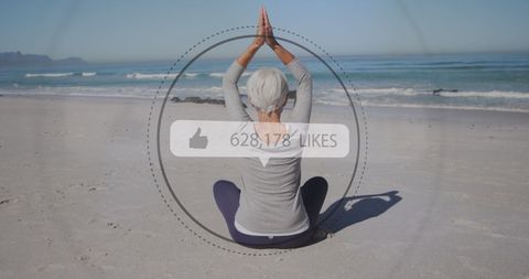 Woman Engaging in Yoga on Beach with Digital Likes Overlay