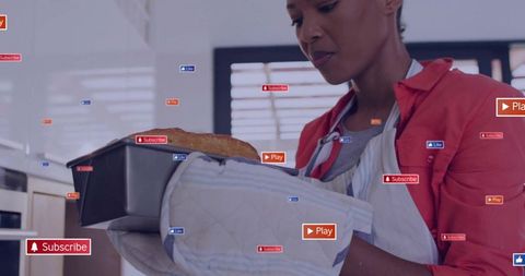 Woman wearing apron holding fresh loaf with social media overlay badges in kitchen
