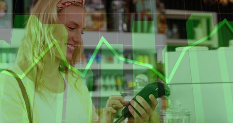 Caucasian woman using credit card with digital metrics overlay