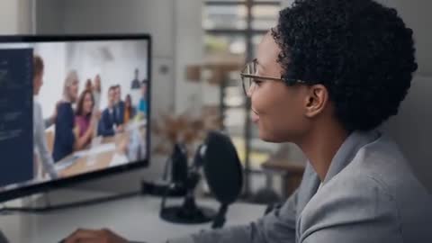 Virtual team meeting with professional woman reacting and coding at desktop workstation