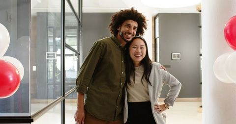 Diverse Business Team Celebrating Office Opening with Joyful Poses