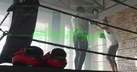 Two boxers sparring in industrial gym ring with red boxing shoes and green data overlay