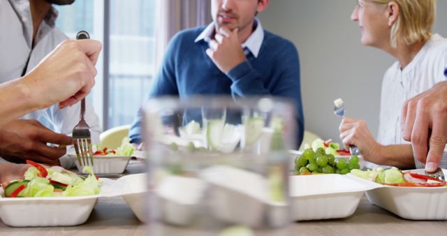 Group of Colleagues Enjoying Healthy Lunch Together in Office - Download Free Stock Images Pikwizard.com