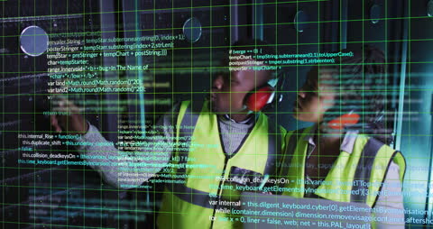 African American Engineers Analyze Data in Server Room