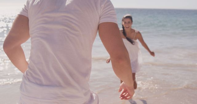 Young Couple Running on Beach with Smiles - Download Free Stock Images Pikwizard.com
