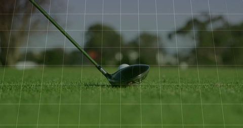 Golf driver aligning for perfect shot on green fairway