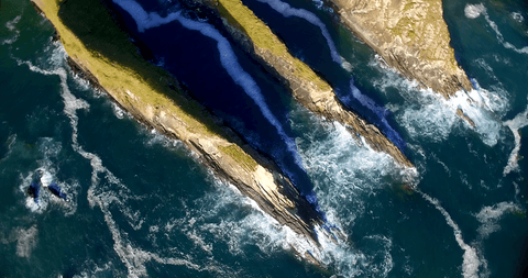stunning aerial view of rock formations by transparent sea waters - Download Free Stock Videos Pikwizard.com