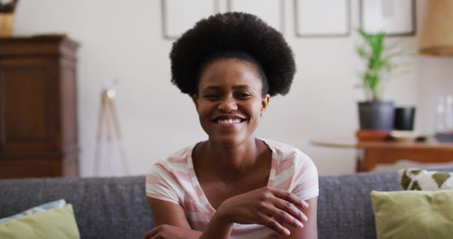 Smiling Woman Sitting on Couch in Modern Living Room - Download Free Stock Images Pikwizard.com