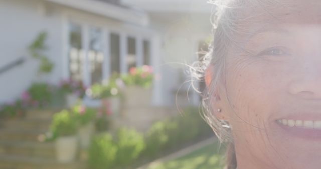 Senior Woman Smiling in Sunlight, Suburban Home Background - Download Free Stock Images Pikwizard.com