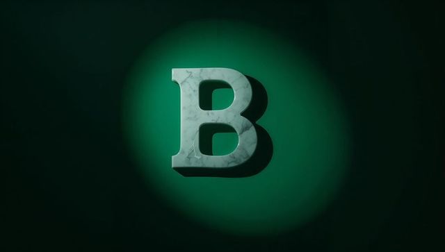 Marble-textured b under teal spotlight against dark green wall