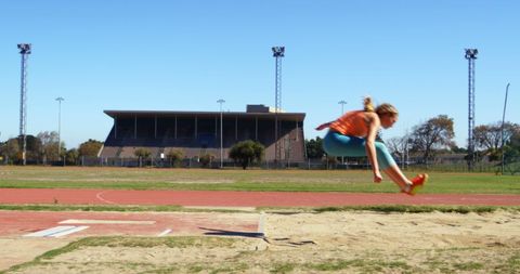 Female Athlete Training Long Jump in Outdoor Sports Venue - Download Free Stock Images Pikwizard.com