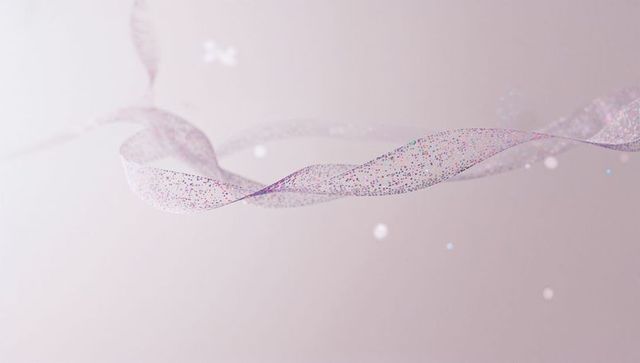 Delicate twisting sheer ribbon mesh floating with confetti and bokeh on pastel backdrop