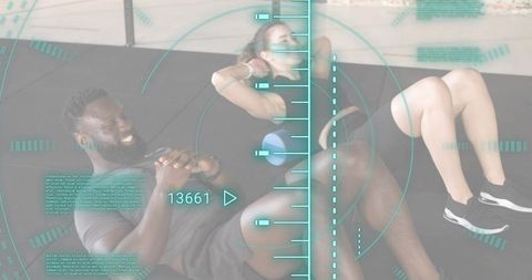 Fitness duo performing core crunches with blue foam roller and teal hud fitness interface