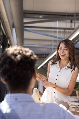 Coworkers Collaborate on Project in Modern Office Space
