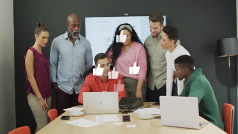 Diverse Business Team Collaborating on Project in Office Setting