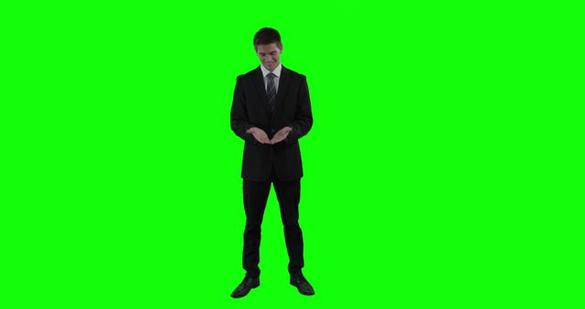 Businessman in Suit Presenting Against Green Screen Background - Download Free Stock Images Pikwizard.com