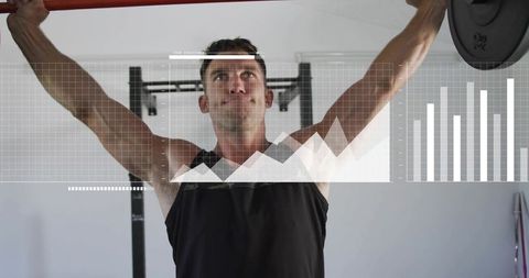 Male athlete lifting overhead barbell with fitness analytics overlay tracking strength
