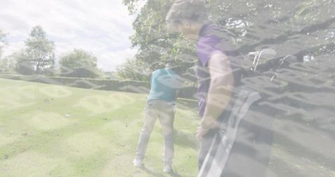 Golfer swinging on sunlit fairway while partner watches with golf bag, coaching motion overlay
