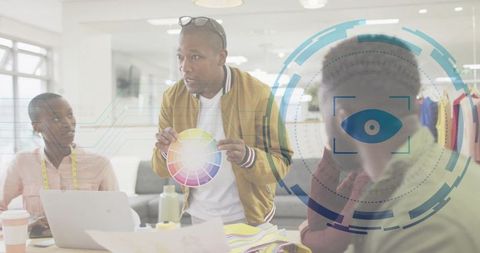 Creative Team Collaborating with Color Wheel in Vibrant Workspace