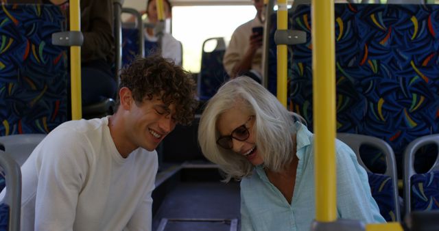 Happy Senior Woman and Young Man Riding Public Bus - Download Free Stock Images Pikwizard.com