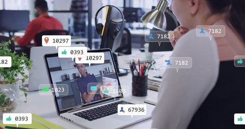 Woman attending virtual meeting in open office with social media notification overlays