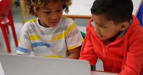 Young Boys Collaborating on Laptop in School Classroom - Download Free Stock Images Pikwizard.com