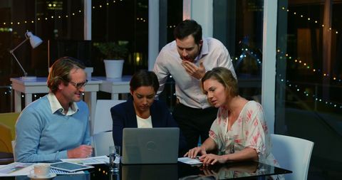 Team Collaboration with Laptop in Night Office Discussion - Download Free Stock Images Pikwizard.com