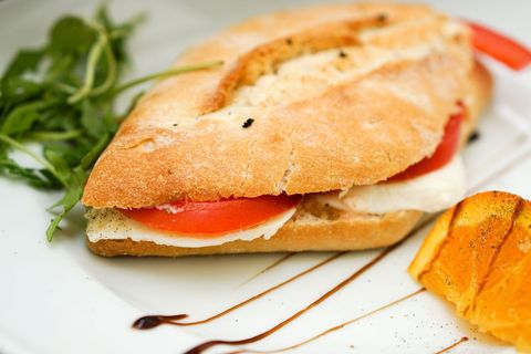 Rustic Caprese Ciabatta Sandwich with Fresh Tomato, Mozzarella, Arugula, Balsamic Drizzle