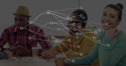 Creative design team collaborating amidst digital network