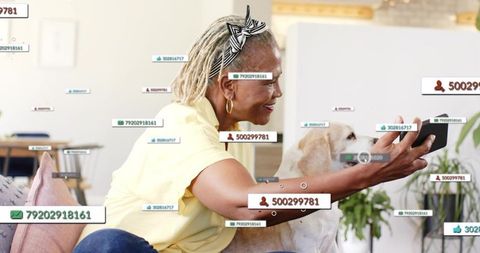 Senior woman taking selfie with dog amid floating social media tags and follower badges