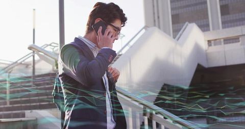 Businessman in Suit Holding Phone Standing on City Steps