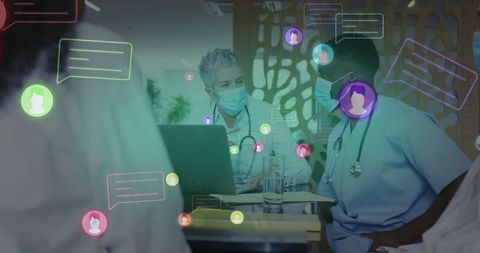 Medical professionals discussing in office with digital chat bubbles