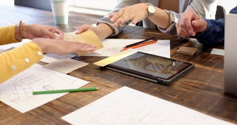 Creative Team Collaborating on Interior Design Project in Studio