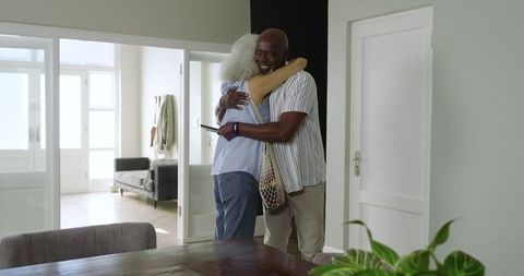 Warm Embrace between Friends in Modern Home Interior