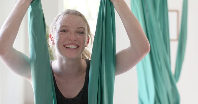 Smiling Teenage Girl Enjoying Aerial Yoga Class - Download Free Stock Images Pikwizard.com