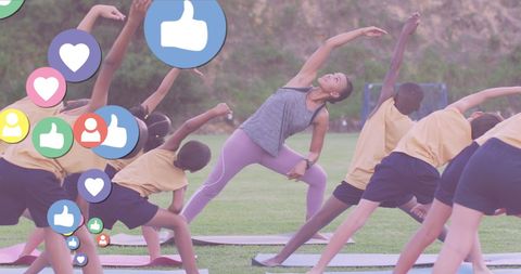 Group Yoga Session Outdoors with Digital Media Elements