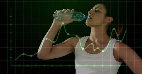 Female athlete drinking water during workout with green health data chart overlay