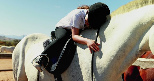 Young Girl Hugging Horse While Sitting in Saddle at Ranch - Download Free Stock Images Pikwizard.com