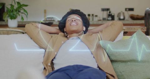 Man relaxing on sofa with waveform illustration