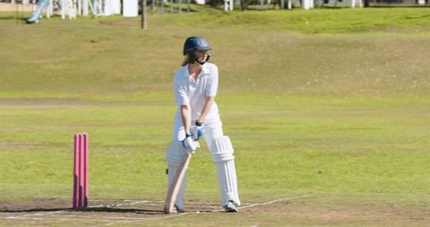 Teenage Girl Playing Cricket Focused and Ready During Match