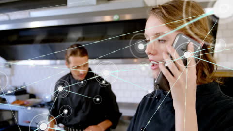 Chef Managing Kitchen Operations with Digital Connectivity