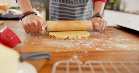 Person Rolling Dough on Wooden Kitchen Counter - Download Free Stock Images Pikwizard.com