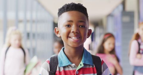 Cheerful African American Boy Smiling in School Hallway - Download Free Stock Images Pikwizard.com
