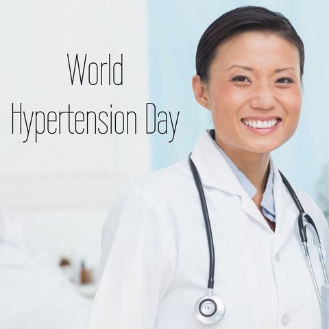 Smiling female doctor promoting world hypertension day awareness