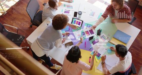 Diverse Team Collaborating on Data Insights in Modern Office