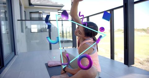 Woman stretching on home balcony with neon ar graphics outdoor yoga fitness session