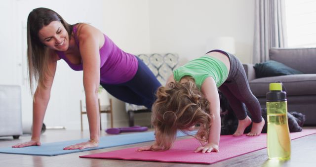 Mother and Child Enjoying Yoga Together at Home - Download Free Stock Images Pikwizard.com