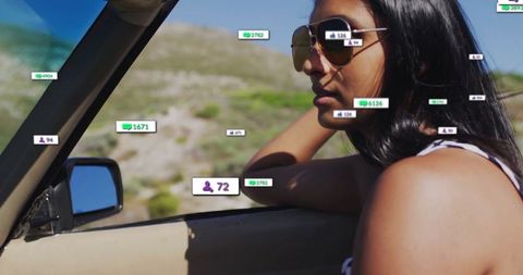 Freedom journey indian woman with sunglasses in convertible