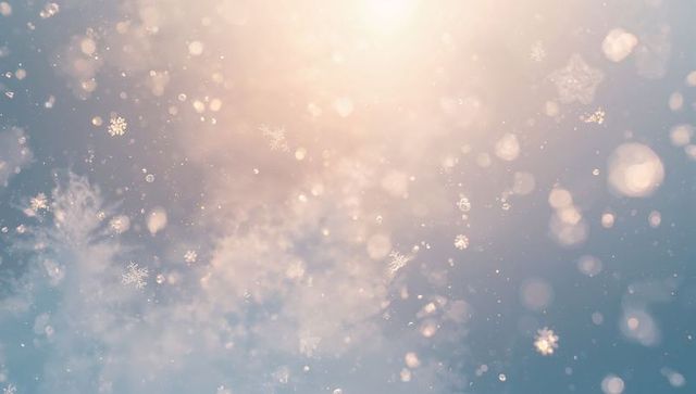 Drifting snowflakes backlit by warm sunlight creating ethereal winter bokeh glow