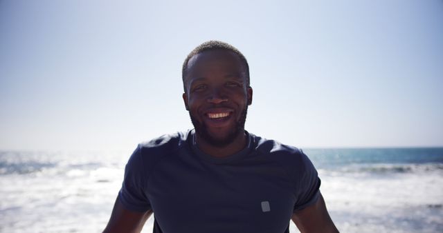 Smiling Man Enjoying Sunny Day at the Beach - Download Free Stock Images Pikwizard.com